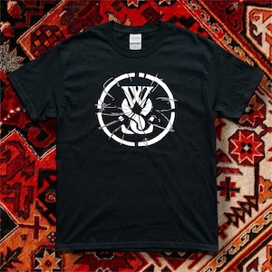 May include: A black short-sleeved t-shirt featuring a white graphic on the chest. The graphic consists of the letters WS inside a circle, with a shattered glass effect radiating from the center. The shirt has a standard crew neckline and a Gildan label.