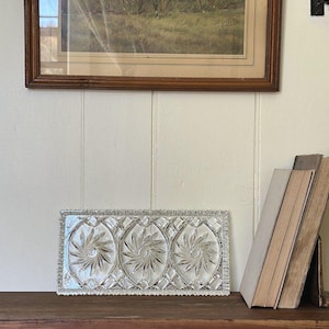 May include: A rectangular clear glass serving tray featuring three circular sections with a pressed pinwheel starburst pattern and a decorative scalloped edge. The tray has a faceted border design and a transparent finish with reflective surfaces.