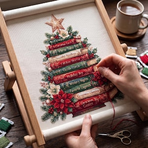 May include: A cross-stitch project on a wooden scroll frame featuring a Christmas tree composed of stacked books with titles like Holiday Joy and Christmas Classics, accented with red poinsettias, green pine needles, and a gold star topper.
