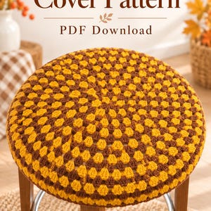 May include: A round stool featuring a crochet cover with a repeating geometric pattern in mustard yellow and dark brown yarn. The text "Crochet Stool Cover Pattern PDF Download" and "Digital Pattern No Physical Item" is visible on the image.