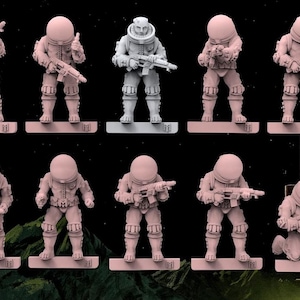 May include: A collection of ten miniature astronaut figurines in light pink and grey, each wearing a space suit with a rounded helmet and holding a rifle. The figures are standing or kneeling on rectangular bases, displayed against a dark space background.