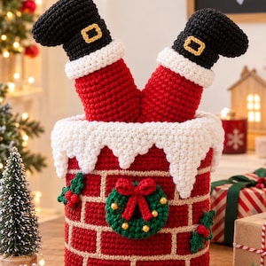 May include: A crocheted Santa Claus legs decoration emerging from a red and white brick chimney. The legs feature black boots with gold buckles and white cuffs. The chimney is adorned with a green wreath, red bow, and holly berry accents.