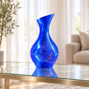 May include: A vibrant cobalt blue vase featuring a distinct spiral texture that wraps around its bulbous body. The vase has a narrow neck that flares slightly at the top, creating an asymmetrical opening. The surface is translucent and glossy.