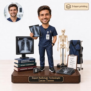 May include: A custom bobblehead figurine of a radiologic technologist wearing navy blue scrubs, holding an X-ray film. The base features a plaque reading Expert Radiologic Technologist Lucas Turner, with books, a skeleton model, and a monitor.