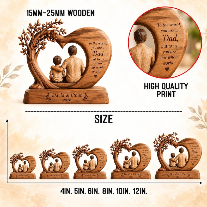 May include: A wooden heart-shaped sculpture featuring a tree and two figures, with the text 'To the world, you are a Dad, but to us, you are our whole world' and 'David & Ethan 2026'. The item is available in sizes from 4 inches to 12 inches.