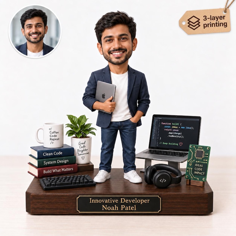 May include: A custom bobblehead figure of a smiling man in a navy blazer, white t-shirt, and jeans, holding a tablet. The figure stands on a wooden base labeled "Innovative Developer Noah Patel" with a laptop, keyboard, books, and a plant.