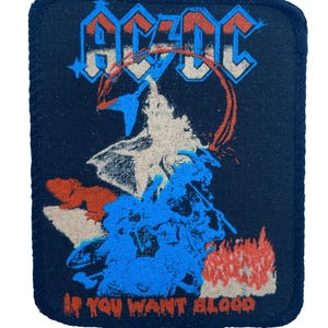 Parche vintage de AC/DC de los 80, "If You Want Blood" (Si quieres sangre), sin usar.