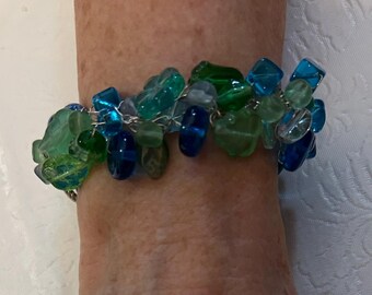Blues and greens bead mix & Wire crocheted bracelet. With sterling silver toggle. Adjustable
