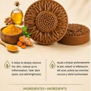 May include: Novassel Turmeric Soap in a round sunflower shape. The packaging displays the product name, benefits, and ingredients including glycerin, ground turmeric, almond oil, and orange oil. The net weight is listed as 100 g or 3.5 oz.