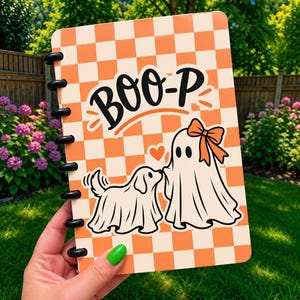 May include: A disc-bound notebook featuring an orange and cream checkered pattern. The cover displays the text BOO-P in black, accompanied by a graphic of a dog and a ghost wearing a bow, both draped in white sheets with black outlines.