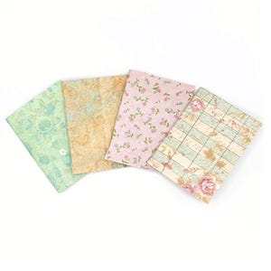 May include: Four patterned paper sheets in various floral designs. The sheets are in shades of green, pink, and brown.