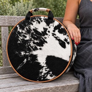 Round Drum Bag in Black and White Goat Hide, Frame Backpack Carrier