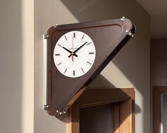 May include: A triangular wall clock with a dark brown translucent frame and a white circular face. The clock features black hour and minute hands, a red second hand, and black rectangular hour markers. The text Gradient Clock is printed on the face.
