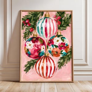 May include: An oil painting on canvas featuring four Christmas ornaments hanging from green pine branches against a light pink background. Two ornaments have vertical red and white stripes, while the other two feature colorful floral patterns.