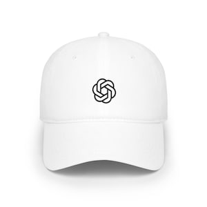 May include: A white baseball cap featuring a black embroidered geometric logo on the front centre. The cap has a structured crown, a curved brim, and a button at the top. The design consists of six interlocking loops forming a circular shape.