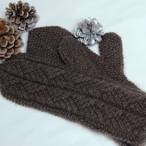 May include: A pair of brown knitted mittens with a cable knit pattern.