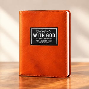 May include: A burnt orange devotional book with a rectangular black label on the front cover. The label features white text that reads One Minute WITH GOD 365 DAILY DEVOTIONS FOR A CLOSER WALK WITH JESUS. The book has a smooth, solid-colored cover.