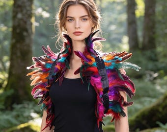 May include: A black sleeveless top worn with a vibrant, multi-coloured feather shoulder wrap. The wrap features a dense arrangement of feathers in shades of bright pink, deep purple, turquoise, orange, and dark red, attached to a black band.
