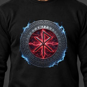 May include: A black long-sleeve sweatshirt featuring a circular emblem with a central red glowing rune, surrounded by a metallic border with engraved characters, all encircled by vibrant blue lightning effects against the dark fabric.