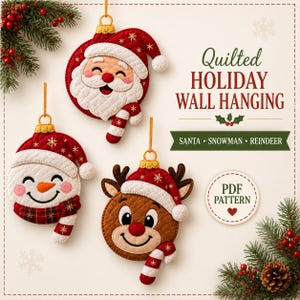 May include: Three quilted holiday wall hanging ornaments shaped like Santa, a snowman, and a reindeer, each with a gold hanging loop. Text reads: Quilted HOLIDAY WALL HANGING, SANTA • SNOWMAN • REINDEER, and PDF PATTERN. Decorated with pine branches.