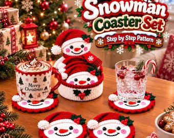 May include: A set of crocheted snowman coasters featuring white faces, orange carrot noses, black eyes, pink cheeks, and red hats with green holly accents. The set includes a matching round container and a pattern guide titled Snowman Coaster Set.