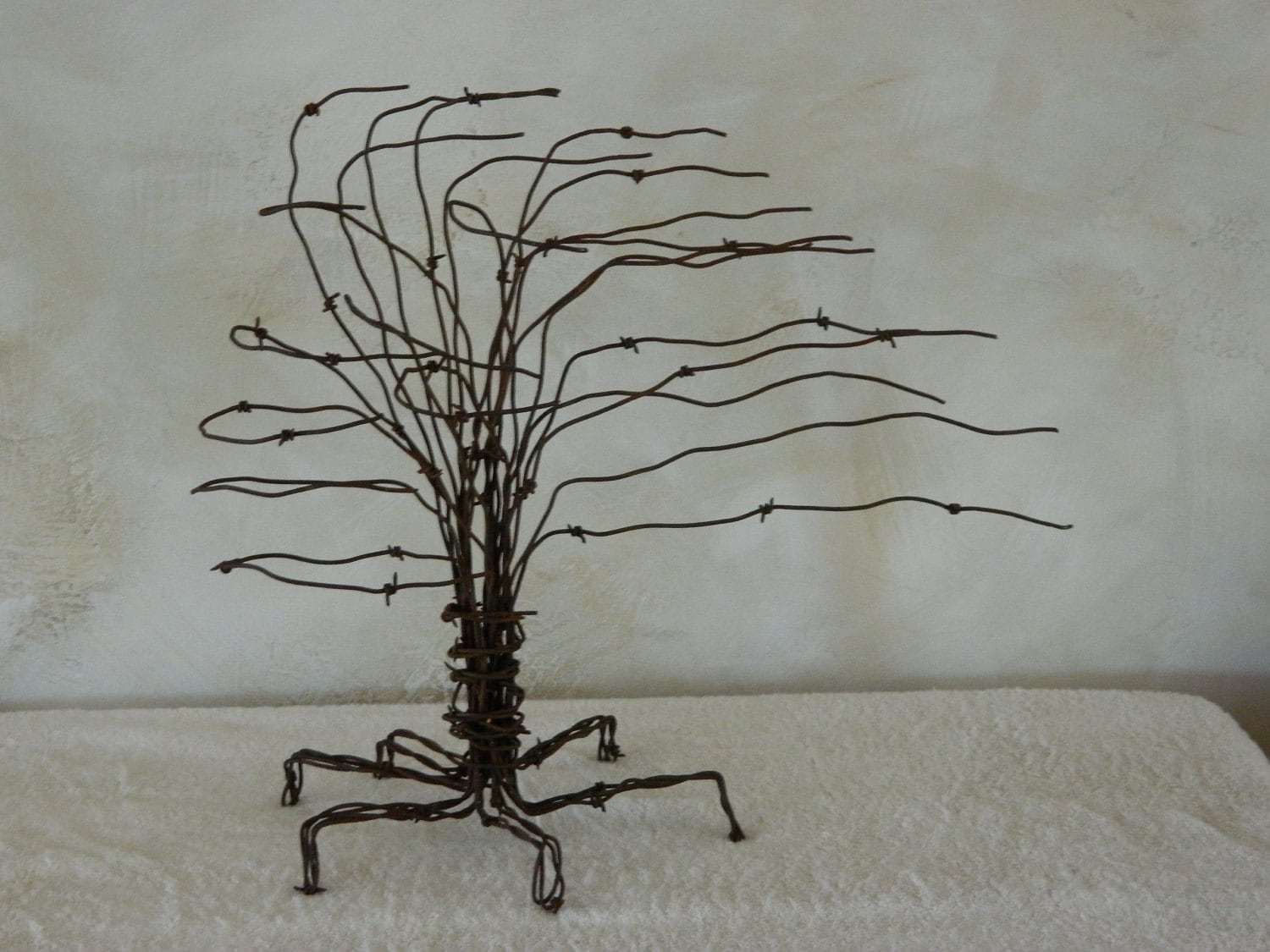 Barbed wire tree deals