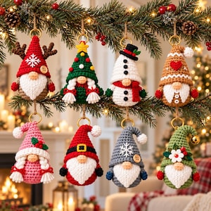 May include: A set of eight crocheted gnome ornaments hanging from a branch. Each gnome features a unique hat design, including reindeer antlers, a Christmas tree, a snowman, a gingerbread pattern, holly, Santa, a snowflake, and floral accents.