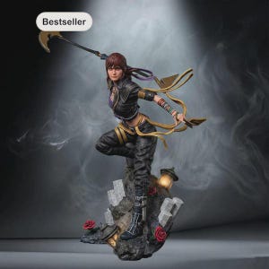 May include: A detailed figurine of a warrior with brown hair, wearing a black jacket and pants, holding a scythe-like weapon. The character stands on a rocky base with red roses and lanterns. A white tag with the text Bestseller is visible.