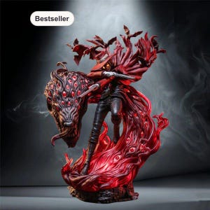 May include: A detailed figurine of a character in a red hat and coat holding a firearm, surrounded by a swirling red mass of eyes and bat-like shapes. The figure has glowing yellow eyes and stands amidst a dynamic, textured base. Text reads Bestseller.