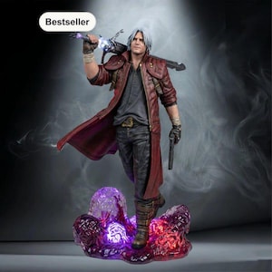 May include: A detailed figurine of a silver-haired character wearing a long red coat, dark shirt, and black pants. The figure holds a large sword across the shoulders and a handgun in the left hand, standing on a glowing purple and red base.