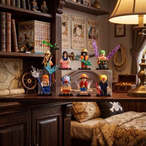 May include: A collection of seven One Piece character minifigures displayed in a clear acrylic case. The figures include Luffy, Zoro, Nami, Sanji, Chopper, Robin, and Brook, each featuring distinct accessories, colourful outfits, and dynamic poses.