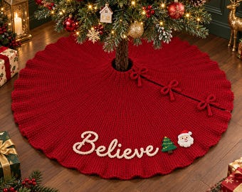 May include: A circular red knitted Christmas tree skirt featuring the word Believe in white script lettering. The skirt includes three decorative red bows along the slit and small felt appliques of a green Christmas tree and Santa Claus.