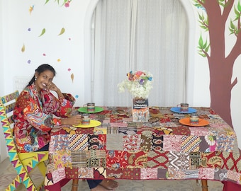 Rectangular red  multicolored patchwork tablecloth  lined with matching plain cotton and edged with a 1 cm brown border.