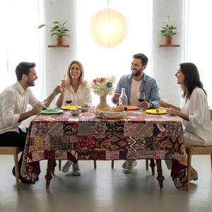Rectangular red multicolored patchwork tablecloth lined with matching plain cotton and edged with a 1 cm brown border. image 2