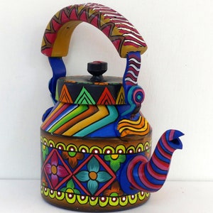 Hand painted tea pot with unique design