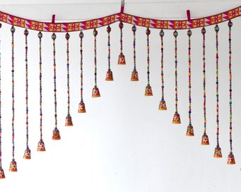 Top garland for door or window in pearls of all colors and small wooden bell