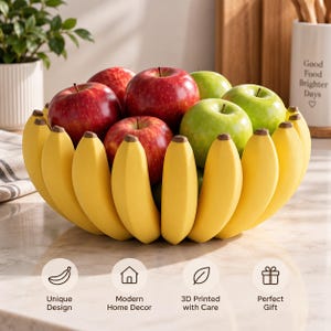 Peut inclure: Un bol à fruits en forme de grappe de bananes jaunes, rempli de pommes rouges et vertes. Le bol présente un design incurvé et segmenté ressemblant à des peaux de bananes individuelles disposées en cercle pour maintenir les fruits au centre.