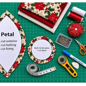 Puede incluir: Un dise&ntilde;o de proyecto de costura con una plantilla en forma de p&eacute;talo etiquetada como 'Petal' con instrucciones de corte, una plantilla circular 'Back Center piece', telas rojas y blancas, hilos, alfileres, tijeras, un marcador y una cinta m&eacute;trica.