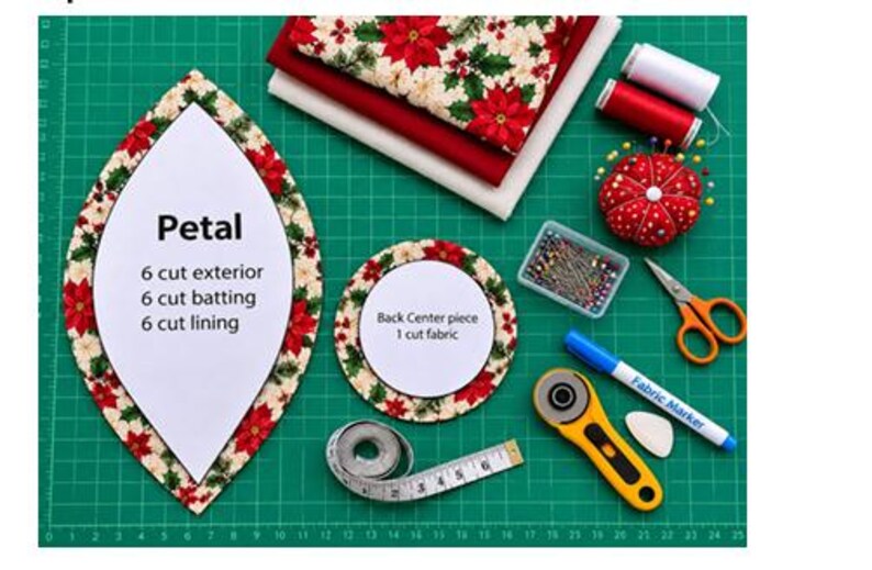 Puede incluir: Un dise&ntilde;o de proyecto de costura con una plantilla en forma de p&eacute;talo etiquetada como 'Petal' con instrucciones de corte, una plantilla circular 'Back Center piece', telas rojas y blancas, hilos, alfileres, tijeras, un marcador y una cinta m&eacute;trica.