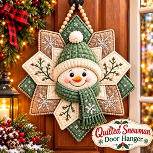May include: A quilted snowman door hanger featuring a star-shaped base in shades of green, brown, and cream with embroidered snowflake and branch patterns. The central snowman wears a green knit-style hat with a pom-pom and a matching scarf.