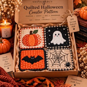 May include: A cardboard box containing four square quilted coasters featuring Halloween designs: an orange pumpkin, a white ghost on a black background, a black bat on an orange background, and a black spiderweb on a beige background. The box lid reads Quilted Halloween Coaster Pattern.