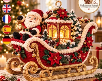 May include: A crocheted Santa Claus figure sits in a red and gold sleigh, holding a small lantern. The sleigh is decorated with green pine branches, red poinsettia flowers, pinecones, and gold bells. A central illuminated lantern sits inside.