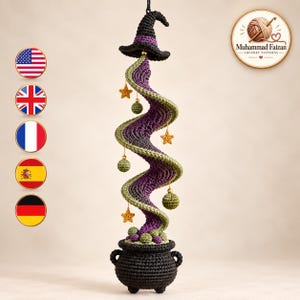 May include: A crocheted hanging decoration featuring a black witch hat atop a spiraling purple and green column emerging from a black cauldron. The spiral is adorned with small yellow crocheted stars and green spheres. Text reads Muhammad Faizan.