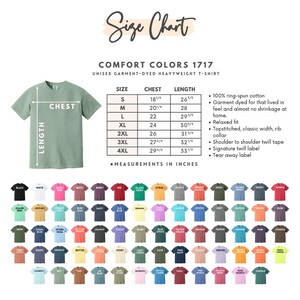 May include: A Comfort Colors 1717 unisex garment-dyed heavyweight t-shirt size chart. It features a sage green t-shirt diagram with chest and length measurement lines, a table with sizes S to 4XL in inches, and a grid of many color swatches.