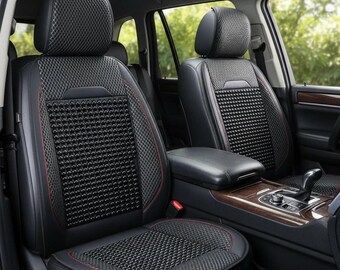 May include: Black car seat covers featuring a textured mesh center panel with small raised beads, surrounded by smooth black side panels with red stitching accents. The headrests and seat sections include a breathable mesh fabric design.