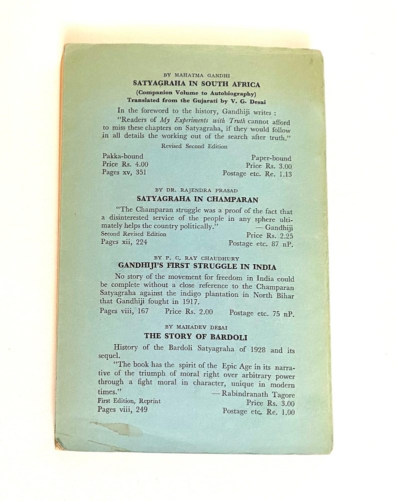 May include: A vintage book cover with text in English, featuring titles like "Satyagraha in South Africa" and "The Story of Bardoli." The cover is light green with black text, and includes author names and book prices.