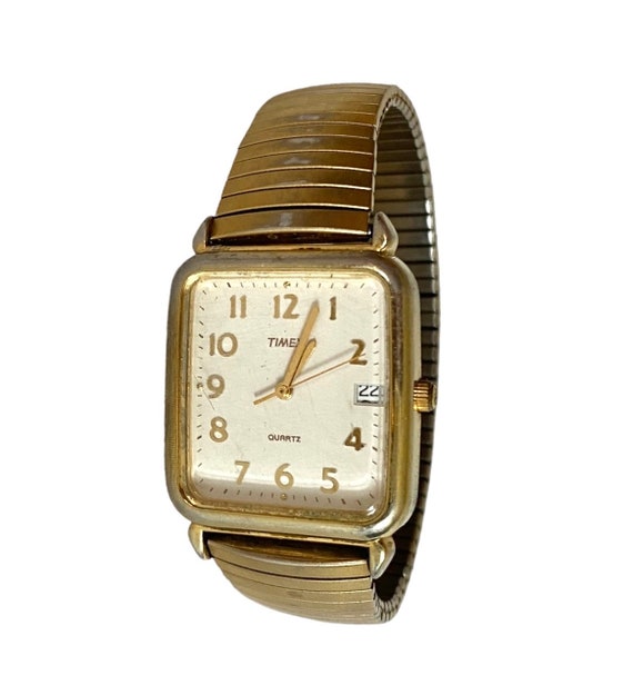 Reloj TIMEX Tank para hombre Caja en tono dorado y banda elastica Reloj analogico de cuarzo