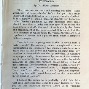 May include: A printed page from a book featuring the title "FOREWORD" by Dr. Albert Einstein. The text discusses facts, history, and the importance of individual responsibility, with references to Gandhi and the Nuremberg trials. The page is aged with a vintage aesthetic.