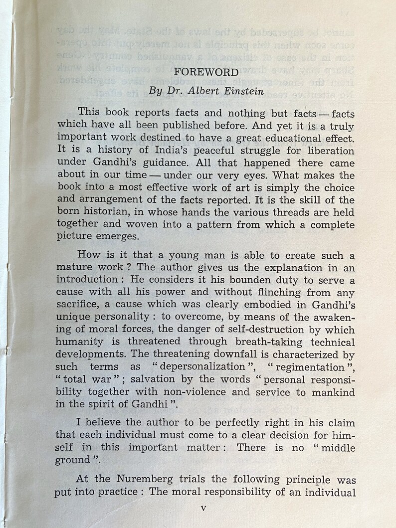 May include: A printed page from a book featuring the title "FOREWORD" by Dr. Albert Einstein. The text discusses facts, history, and the importance of individual responsibility, with references to Gandhi and the Nuremberg trials. The page is aged with a vintage aesthetic.