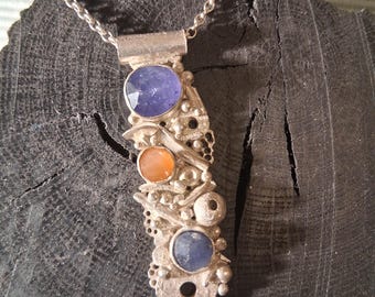 Handmade sterling silver crustacean necklace with semi precious stones.
